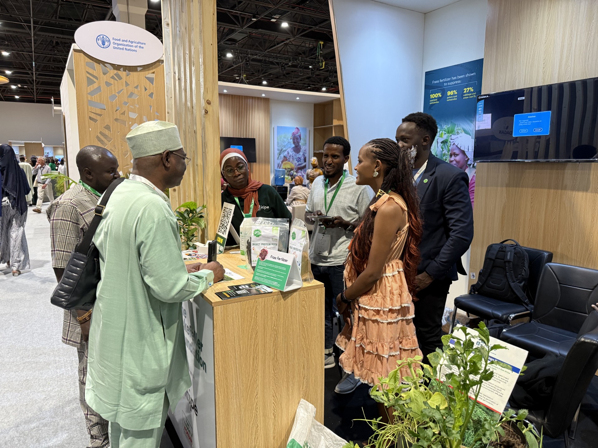 icipe Director General Dr Abdou Tenkouano engaging with the team at the icipe booth following a panel discussion with other distinguished panelists at the Africa Food Systems (AFS) Summit researchers’ forum.
