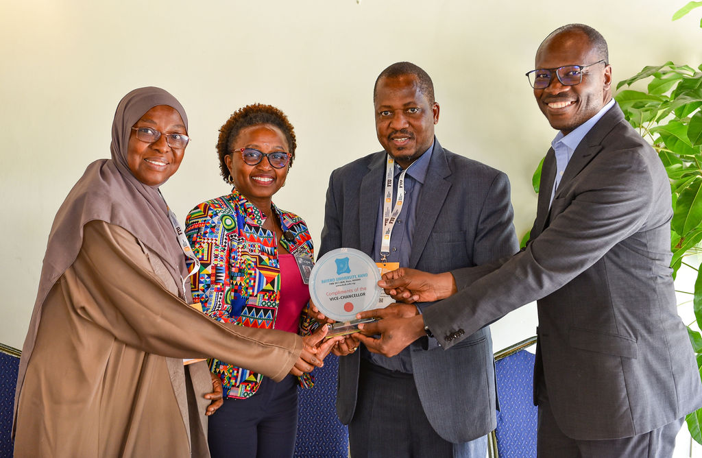 Bayero University Vice Chancellor Prof Haruna Musa (Middle) and Deputy Vice Chancellor Prof Amina Mustafa (Left) presenting the university plaque to the icipe team led by the head of Policy and Enabling Environment, Dr Julius Ecuru (Right), and Dr Everlyne Nguku (second left) when they visited the Duduville campus yesterday.
