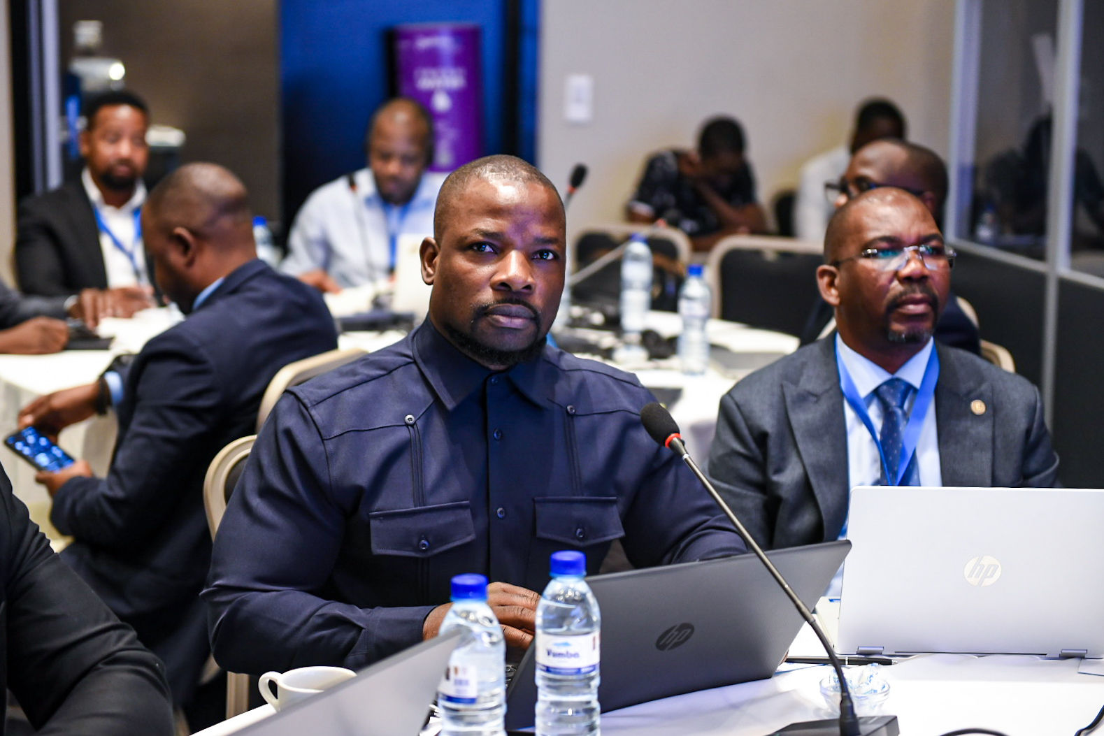 Participants follow the workshop proceedings .